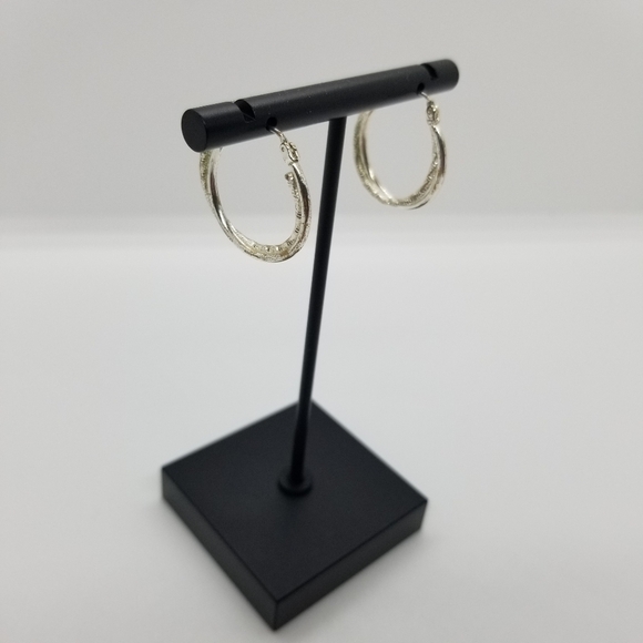 silver tone textured twist hoop earrings - Picture 1 of 2